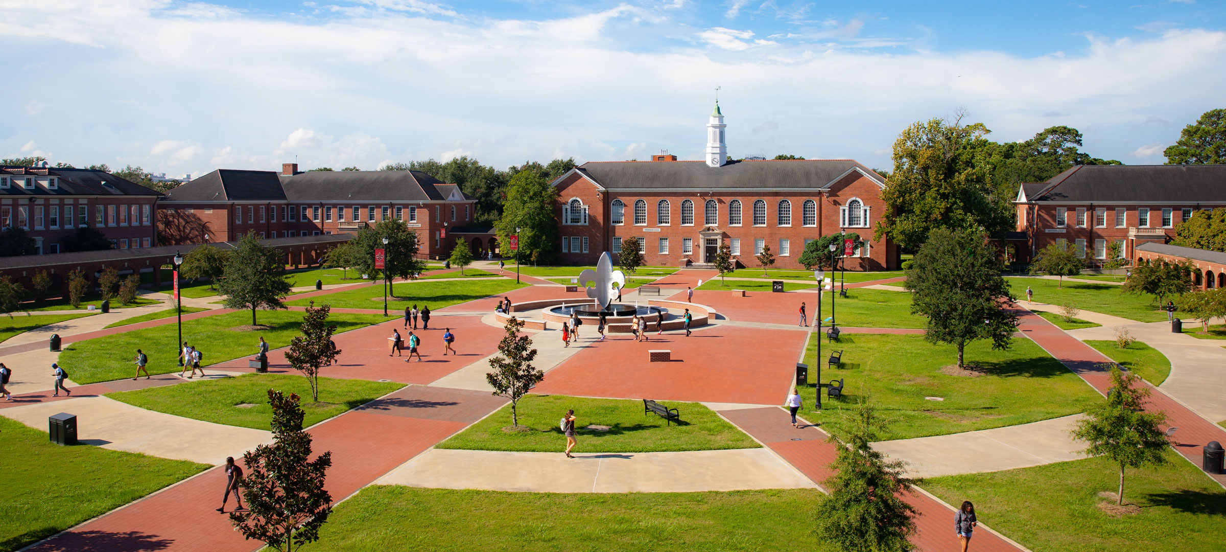 Aerial view of the 鶹ҹ Quad with the fleur de lis statue and sidewalks